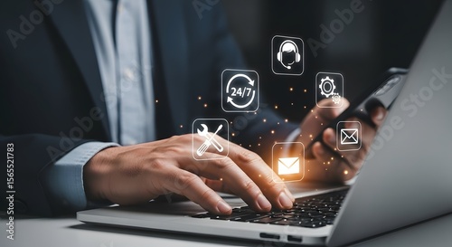 A business professional uses a laptop with customer service icons hovering for support and efficient online workflow management on a computer.