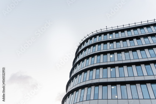 Obraz na plátně Beautiful modern building with glass against the sky