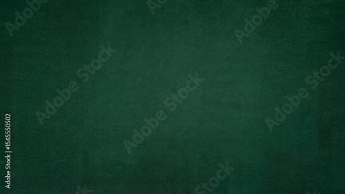 A deep textured emerald green background with subtle variations in shade and a slightly rough surface perfect for design