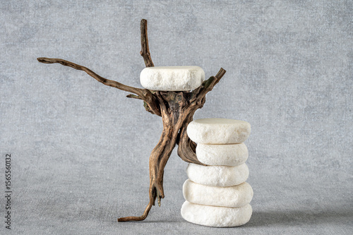 Foto Empty stone podium, pieces of snag on grey background