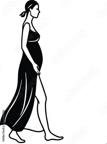 Elegant Silhouette of a Pregnant Woman Walking on the Beach