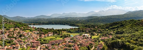 Tableau sur toile Aerial panoramic view of Avigliana end lake Grande, Italy, Piedmont, Turin, Italy A beautiful town with and red-roofed houses, surrounded by the green hills of Susa and trees