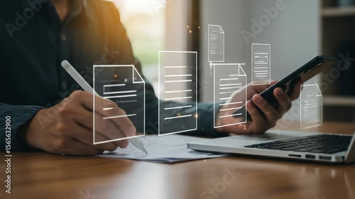 Digital Documentation: A modern man uses a smartphone and digital pen for online data processing on a laptop, merging paperwork with technology.