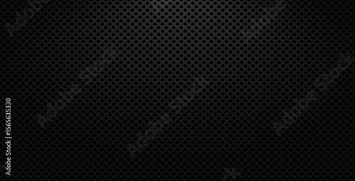 Black perforated metal texture background with round holes and light gradient