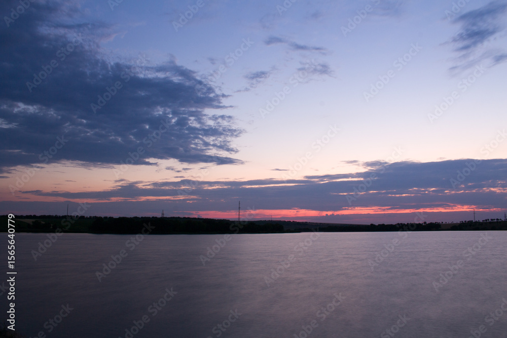 Naklejka premium A body of water with a bridge in the background