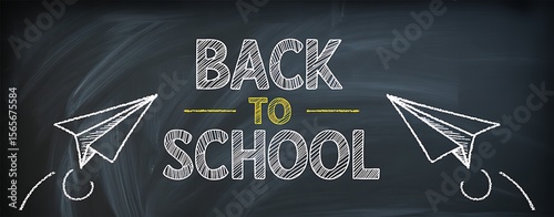 Back to school is written on a chalkboard with paper airplane drawings