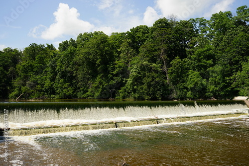 Waterfall dam flowing into the Sheboygan River at Settlers Park in Sheboygan Falls, Wisconsin. 