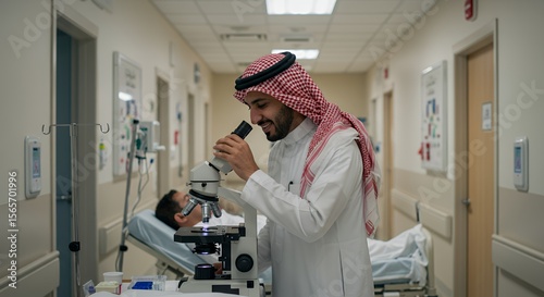 Focused Arab doctor examines a sample under a microscope in a hospital corridor, a patient rests nearby.