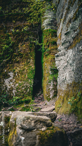 Eerie cave in the rock face of the Allegheny National Forest photo