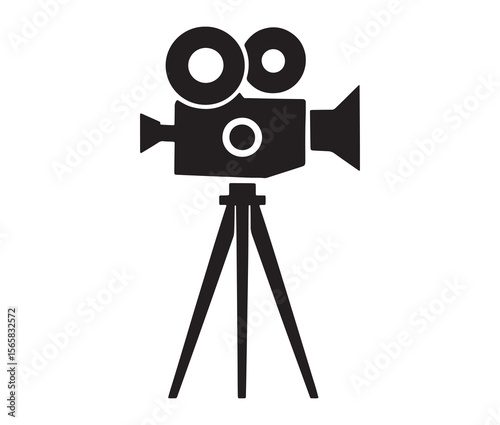 Silhouette of an old movie camera on a tripod. Vintage movie camera on tripod silhouette.
