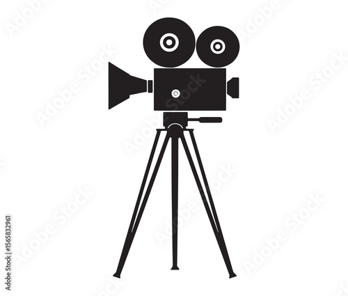 Silhouette of an old movie camera on a tripod. Vintage movie camera on tripod silhouette.