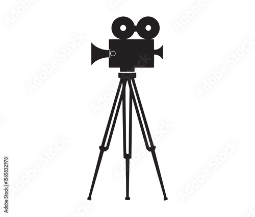 Silhouette of an old movie camera on a tripod. Vintage movie camera on tripod silhouette.