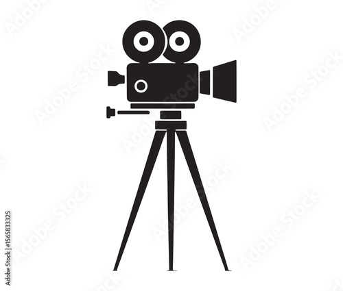 Silhouette of an old movie camera on a tripod. Vintage movie camera on tripod silhouette.