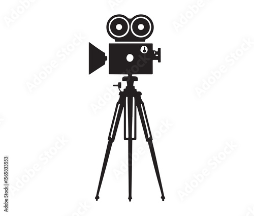 Silhouette of an old movie camera on a tripod. Vintage movie camera on tripod silhouette.