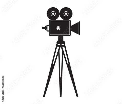 Silhouette of an old movie camera on a tripod. Vintage movie camera on tripod silhouette.