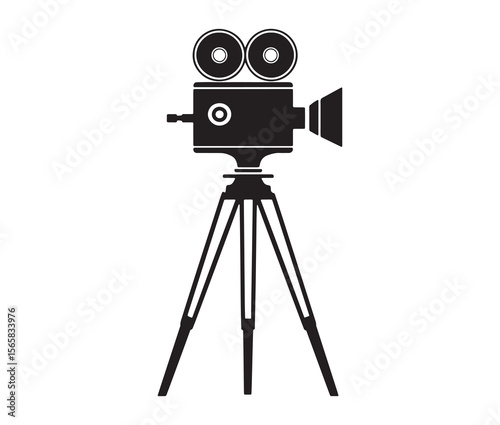 Silhouette of an old movie camera on a tripod. Vintage movie camera on tripod silhouette.