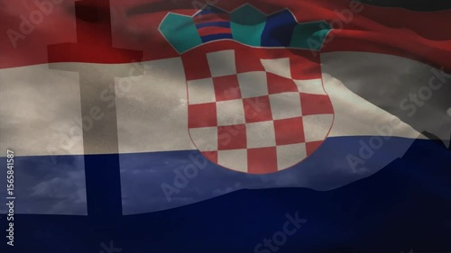 Flag lifting by breeze, unfolding ripples and bulging shield, visualizing wind-driven fabric motion