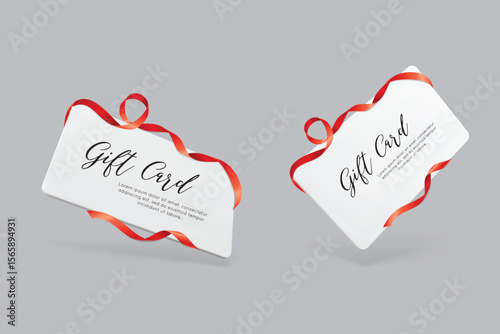 Two elegant gift cards decorated with shiny red ribbons. Suitable for discounts, branding, and product marketing visuals.