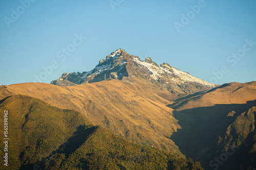 Rucu Pichincha at Dawn: Snowy and Golden Andean Landscape
