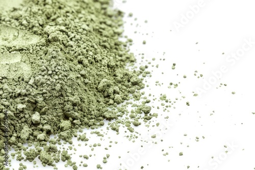 detailed color picture of border surface close up of powdered green tea isolated on white
