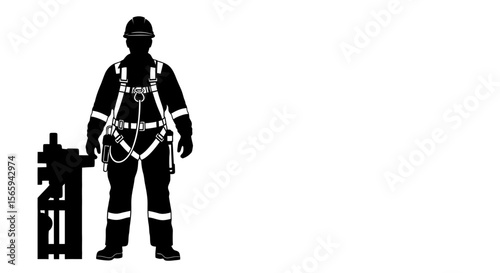 Silhouette of a worker in safety gear standing next to industrial equipment.