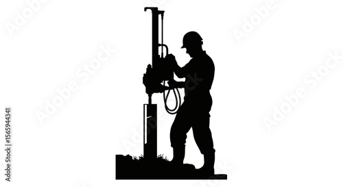 A silhouetted worker operates a drilling rig, diligently performing ground work.
