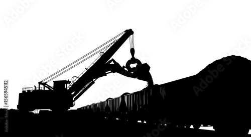 Silhouette of a large industrial excavator loading coal into train cars.