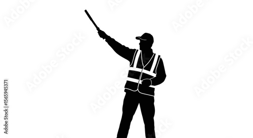 Silhouette of a road worker directing traffic with a signal wand.