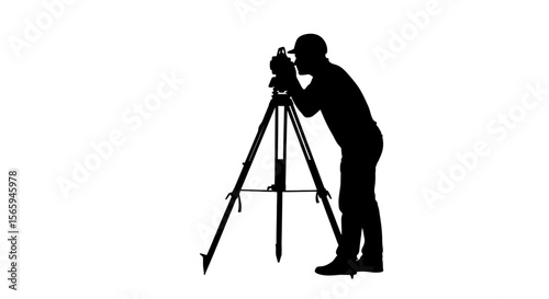 Silhouette of a surveyor using surveying equipment on a tripod, taking measurements.