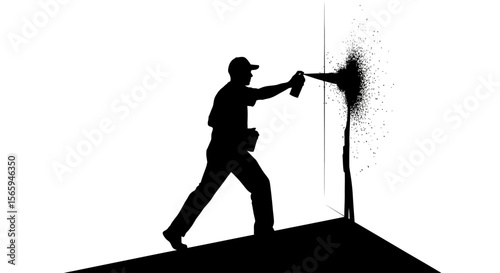 Silhouette of a graffiti artist in action, spraying black paint onto a wall corner.