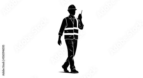 Silhouette of a construction worker walking and holding a radio, communicating.