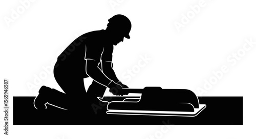 Construction worker kneeling, installing a roof component.