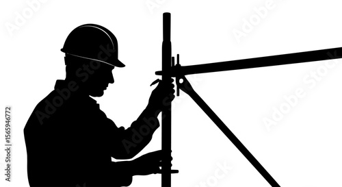 Silhouette of a construction worker adjusting scaffolding structure, working on a project.