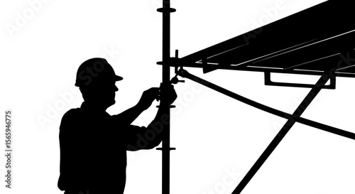 Silhouette of a construction worker adjusting scaffolding, wearing a hard hat.