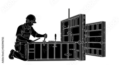 Construction worker assembling formwork for concrete wall.