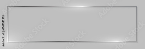 Elegant silver metallic rectangle frame on a smooth grey background, offering a modern and clean design element with a reflective shimmer, suitable for various creative or presentation needs.