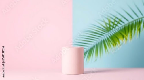 Wallpaper Mural A pale pink cylindrical display stand is set against a backdrop of pink and blue, with a palm leaf casting a shadow Torontodigital.ca