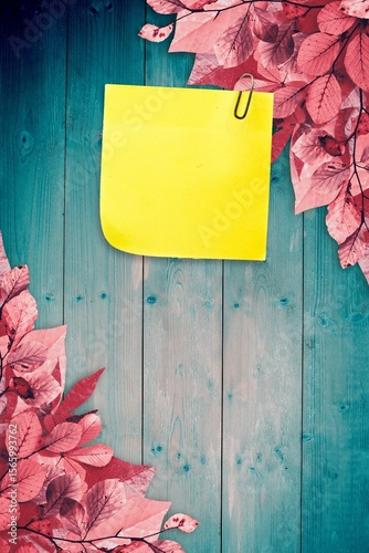 Autumn leaves with yellow note