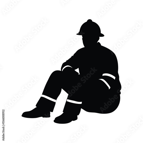 Black silhouette of a firefighter in uniform sitting down resting.