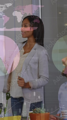 Animation of graphs over diverse businesspeople during presentation