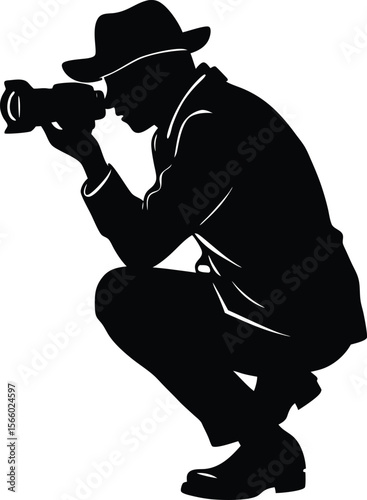 Silhouette of a photographer with a camera in a crouching position