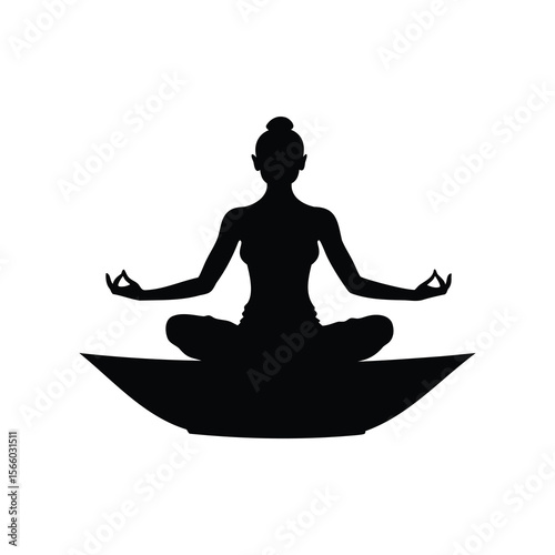 Silhouette of a woman meditating in lotus position on a pillow, isolated