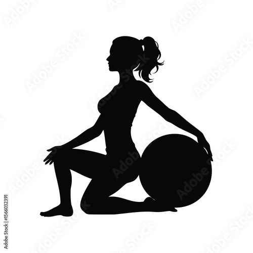 Silhouette of a woman doing fitness exercises with a stability ball