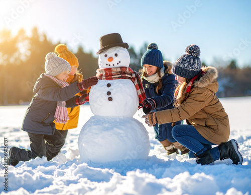 Kids from various backgrounds building a snowman