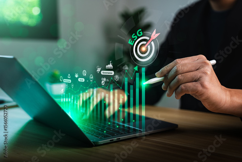 Businessman analyzing ESG data on digital interface with bar chart, environmental icons and corporate responsibility dashboard, promoting sustainable development, green investment, ethical governance