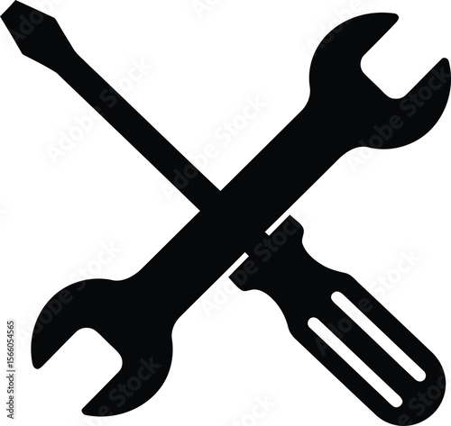 A wrench and screwdriver are crossed isolated on white background