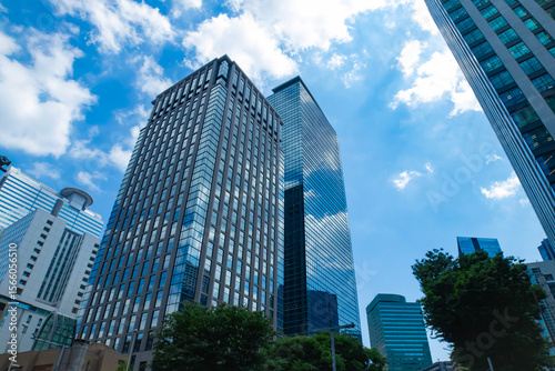 A cityscape of moving cloud reflecting the office building at the business town wide
