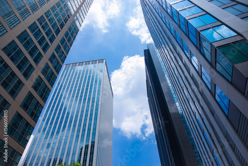 Photography A cityscape of moving cloud reflecting the office building at the business town
