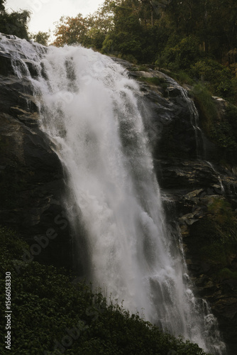 Scenic view of Siriphum Waterfall in Chiang Mai, Thailand – a tall waterfall flowing through green jungle in Doi Inthanon National Park.