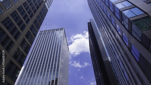 Wallpaper Mural A timelapse of moving cloud reflecting the building at the city low angle view tilt Torontodigital.ca